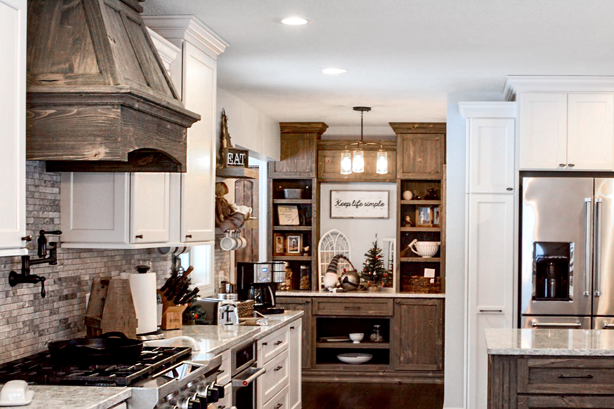What is the best quality cabinet? Hear cabinetry reviews and testimonies from homeowners about the quality of their Dura Supreme Cabinetry, like this kitchen remodel story with white painted kitchen cabinets and rustic weathered wood accents.